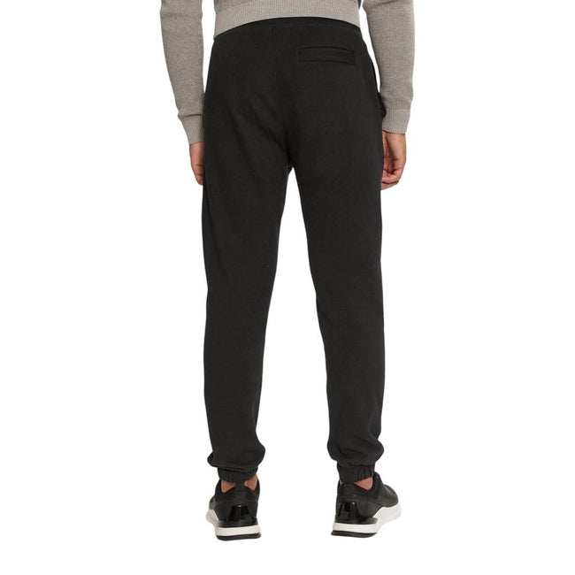 Black Organic Cotton Joggers Workout PantThe Calvin Klein Jeans CHENILLE MONOLOGO SW J30J326685 men’s sweatpants are made from 100% organic cotton, ensuring exceptional comfort and a soft feel against the skin. These pants are perfect for daily activities