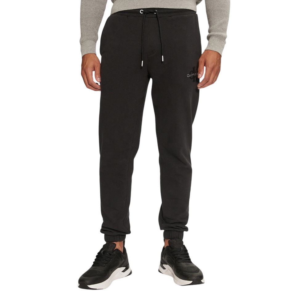Black Organic Cotton Joggers Workout PantThe Calvin Klein Jeans CHENILLE MONOLOGO SW J30J326685 men’s sweatpants are made from 100% organic cotton, ensuring exceptional comfort and a soft feel against the skin. These pants are perfect for daily activities
