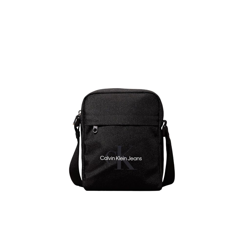 Black Recycled Polyester Messenger BagThe Calvin Klein SPORT ESSENTIALS REPORTER18 M K50K512011 men’s crossbody bag is the perfect accessory for those seeking practicality and style. Made from 100% recycled polyester, this bag is not only sustainable but