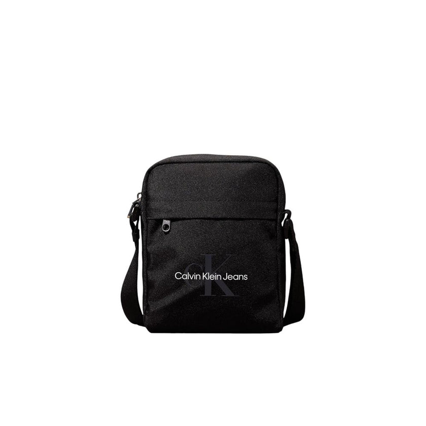 Black Recycled Polyester Messenger BagThe Calvin Klein SPORT ESSENTIALS REPORTER18 M K50K512011 men’s crossbody bag is the perfect accessory for those seeking practicality and style. Made from 100% recycled polyester, this bag is not only sustainable but