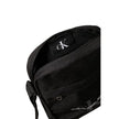 Black Recycled Polyester Messenger BagThe Calvin Klein SPORT ESSENTIALS REPORTER18 M K50K512011 men’s crossbody bag is the perfect accessory for those seeking practicality and style. Made from 100% recycled polyester, this bag is not only sustainable but