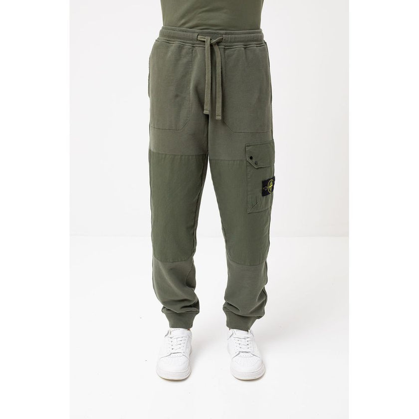 Green Cotton Men's Tracksuit PantsElevate your casual ensemble with the sleek sophistication of Stone Island’s men’s tracksuit trousers. Crafted from 100% premium cotton for unmatched comfort, these trousers flaunt a fresh green hue that embodies the bold