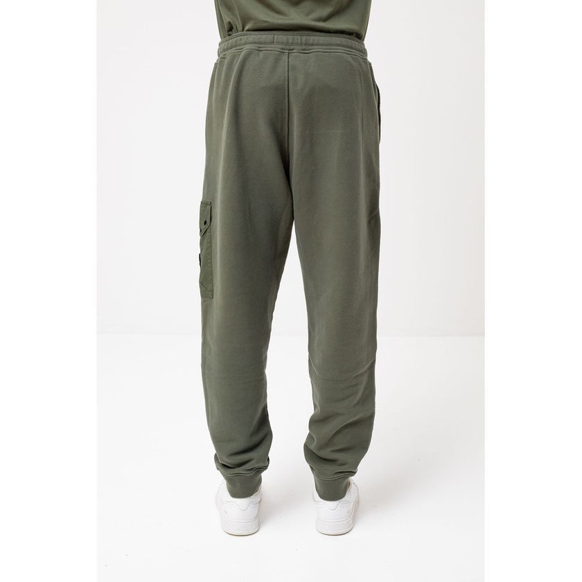 Green Cotton Men's Tracksuit PantsElevate your casual ensemble with the sleek sophistication of Stone Island’s men’s tracksuit trousers. Crafted from 100% premium cotton for unmatched comfort, these trousers flaunt a fresh green hue that embodies the bold