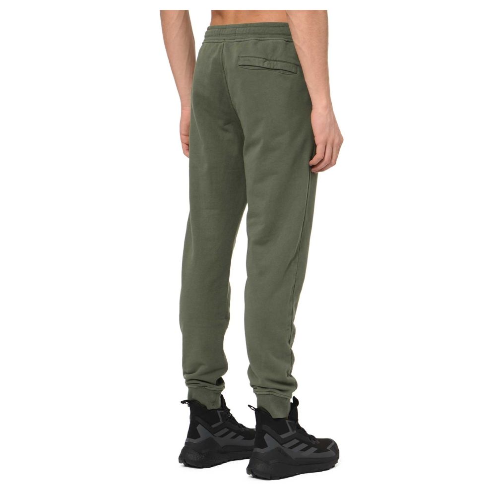 Beige Cotton Men PantsElevate your off-duty repertoire with these impeccably tailored tracksuit trousers from the iconic Stone Island. Crafted from 100% sumptuous cotton to provide both comfort and durability, this pair exudes laid-back luxury. The versat