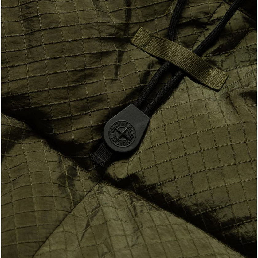 Green Nylon Men ParkaStep into the bold, contemporary world of fashion with this Stone Island down parka, crafted for the trendsetter who isn’t afraid to stand out. The cutting-edge Nylon Metal fabric dazzles with a metallic sheen, showcasing an audacious