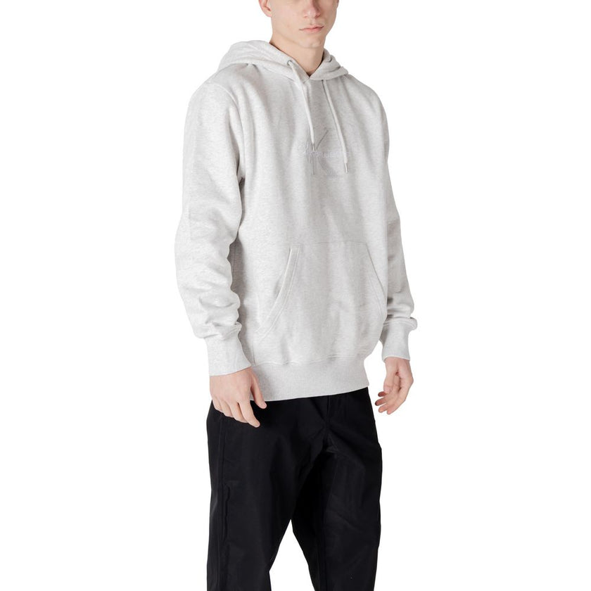 Gray Cotton HoodieThe Calvin Klein Jeans CHENILLE MONOLOGO hoodie for men is an essential piece for your wardrobe. Made from 100% cotton, it offers a soft and comfortable feel, perfect for everyday wear. The minimalist design is enhanced by a chenille log