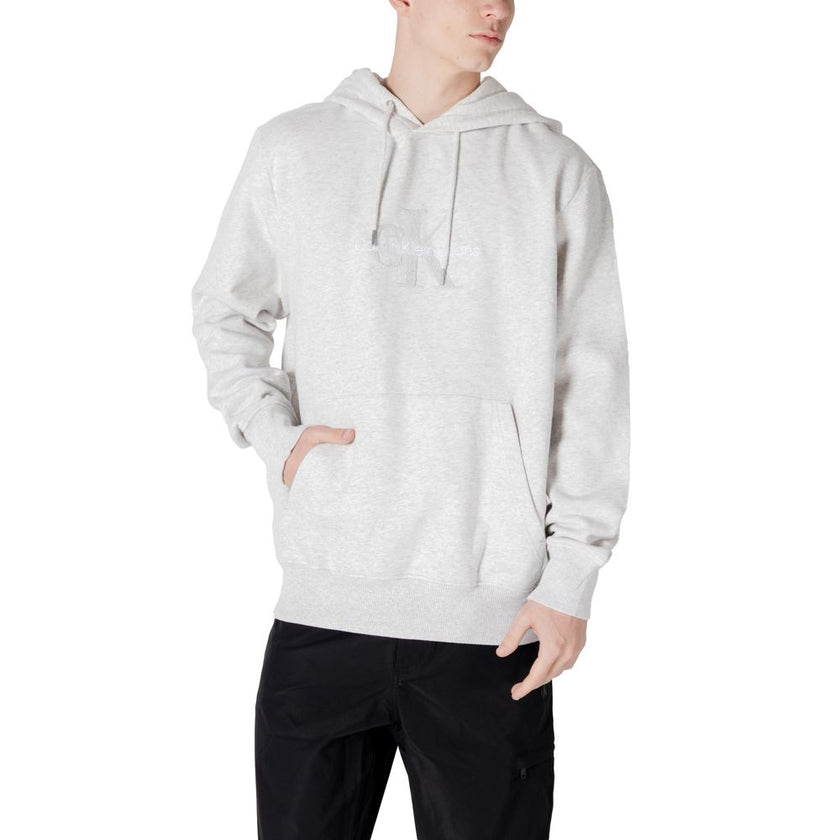 Gray Cotton HoodieThe Calvin Klein Jeans CHENILLE MONOLOGO hoodie for men is an essential piece for your wardrobe. Made from 100% cotton, it offers a soft and comfortable feel, perfect for everyday wear. The minimalist design is enhanced by a chenille log