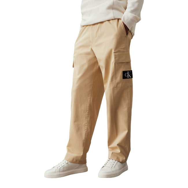 Beige Cotton Cargo PantsBrand: Calvin Klein Gender: Men Type: Trousers Season: Fall/Winter Color: Beige Pattern: Plain Fastening: Zip and button Pockets: Front back side pockets Article code: J30J326829 Composition: 97% cotton and 3% lycra Washing: Machin
