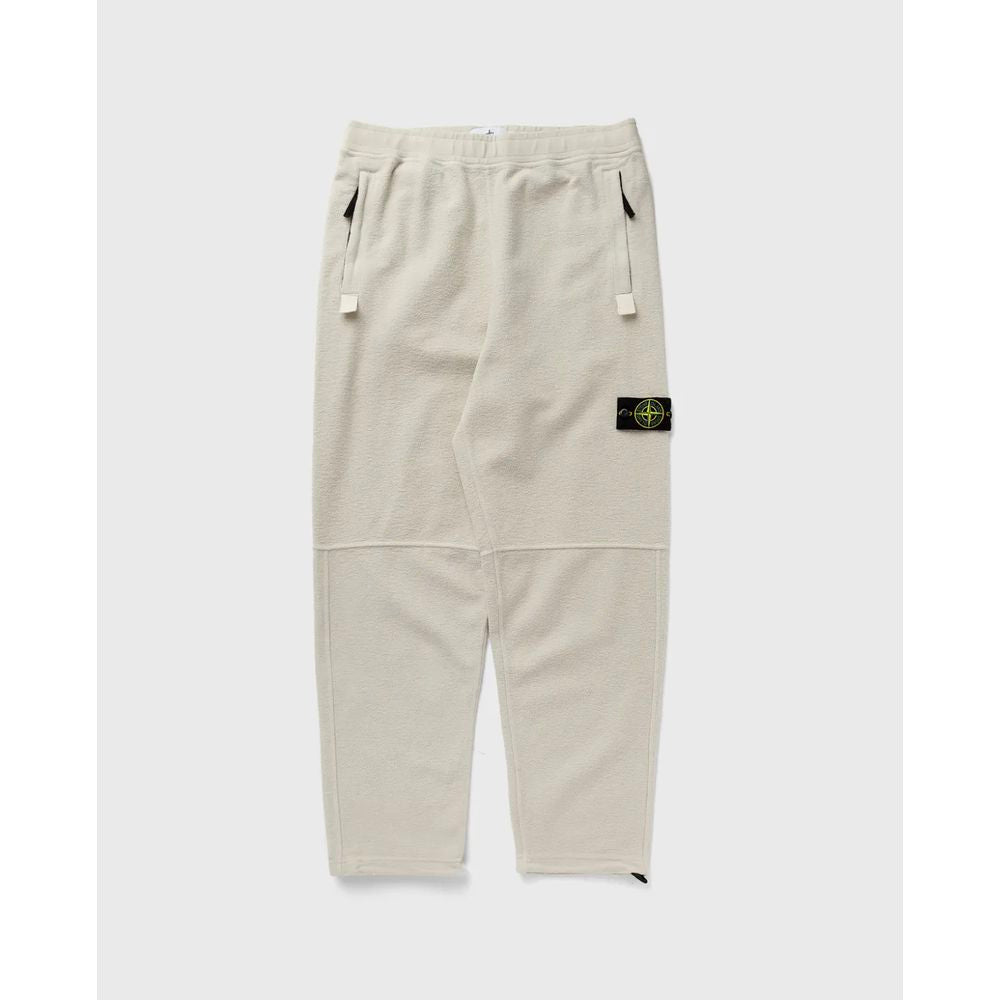 White Cotton Men's TrouserElevate your casualwear repertoire with these impeccably crafted trousers from Stone Island. A fusion of comfort and high-end style, they boast a creamy white hue in sumptuous cotton fleece. Designed with meticulous attention to
