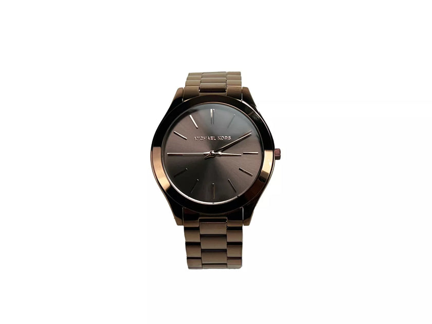 Slim Runway Brown Stainless Steel Watch MK3418 NO BOXStyle: Michael Kors (MK3418) Slim Runway Watch Material: Stainless Steel Features: Non-Numeric Stick Hour Markers, Water Resistant 50m, Minimalistic Design Measures: 42 mm Case SizeSlim Runway Brown Sta