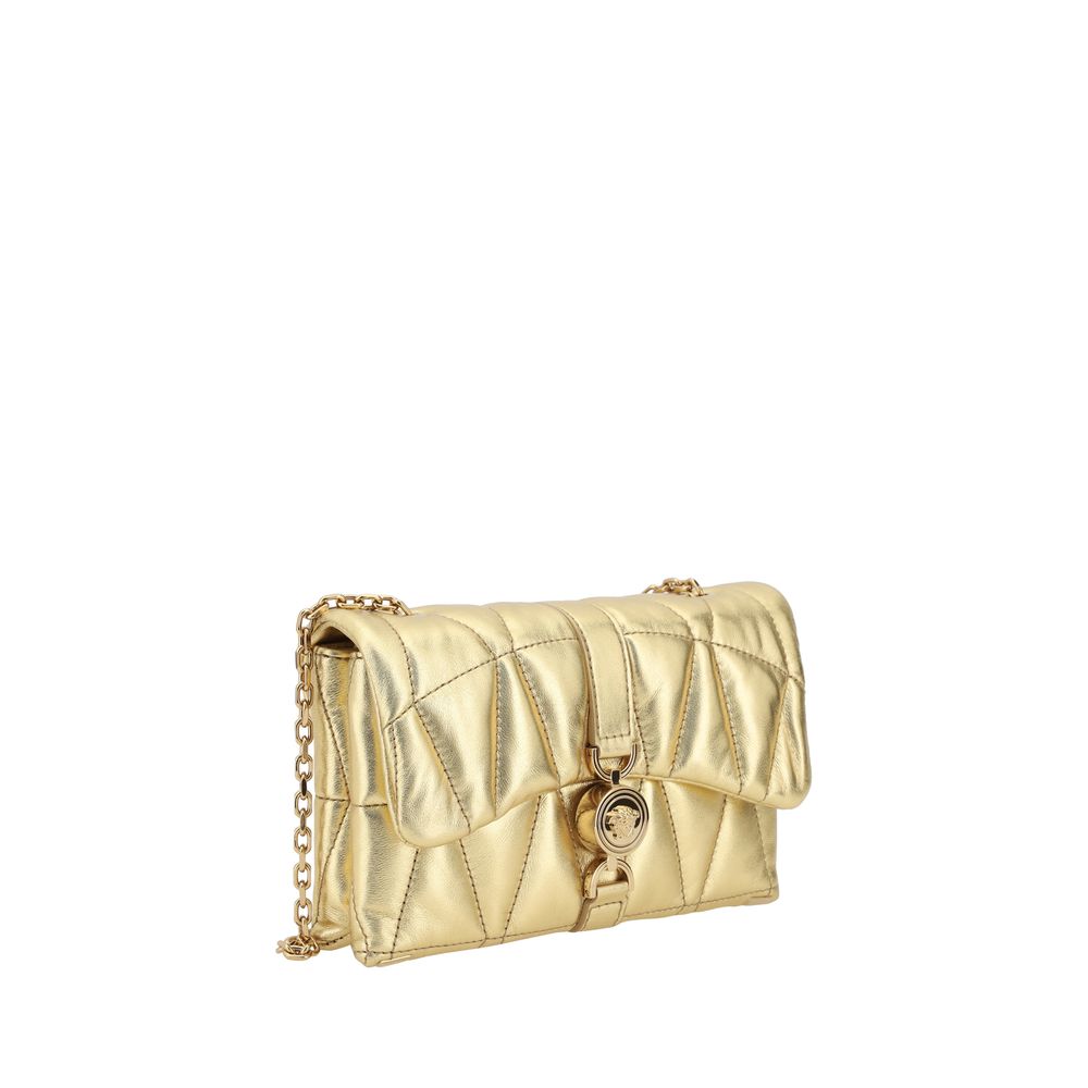 Gold Lamb Ovis Aries Aries Shoulder BagThe Kleio mini Shoulder Bag is made of lambskin leather, with a quilted design that adds a touch of elegance. It features a front closure with a magnetic flap, decorated with the brand’s iconic Medusa head. The chain