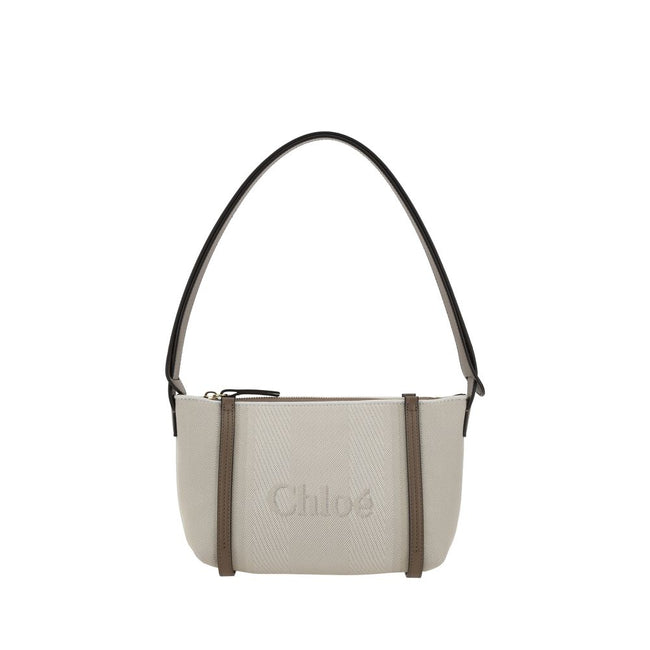 Beige Cotton Shoulder BagChloé’s cotton Carry Shoulder Bag is a stylish and versatile accessory made from durable cotton. It features a flat leather shoulder strap that is comfortable for carrying on the shoulder. The closure features a top zipper, provid