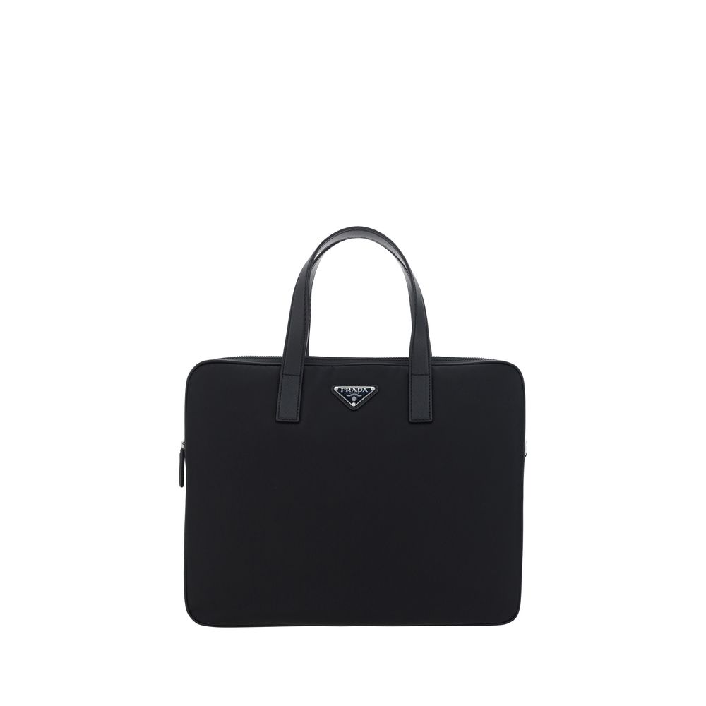Black Polyamide Shoulder BagRe-Nylon Work Shoulder Bag by Prada, top closure by a double-slider round zipper, double flat leather handles, adjustable and removable webing shoulder strap, iconic enameled triangular brand logo plaque applied to front, inter