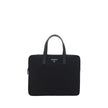 Black Polyamide Shoulder BagRe-Nylon Work Shoulder Bag by Prada, top closure by a double-slider round zipper, double flat leather handles, adjustable and removable webing shoulder strap, iconic enameled triangular brand logo plaque applied to front, inter