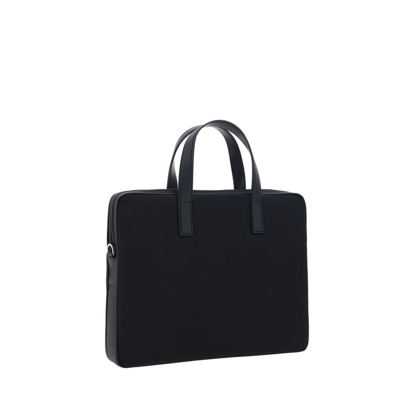 Black Polyamide Shoulder BagRe-Nylon Work Shoulder Bag by Prada, top closure by a double-slider round zipper, double flat leather handles, adjustable and removable webing shoulder strap, iconic enameled triangular brand logo plaque applied to front, inter