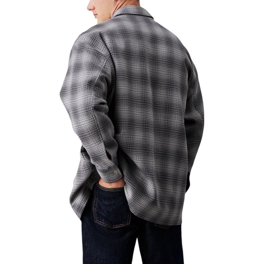 White Cotton ShirtDiscover the CHECK OVERSHIRT J30J326183 long sleeve shirt by Calvin Klein Jeans, a versatile and stylish clothing piece. Made from a blend of 60% cotton and 40% polyester, this shirt provides an excellent combination of comfort and durab