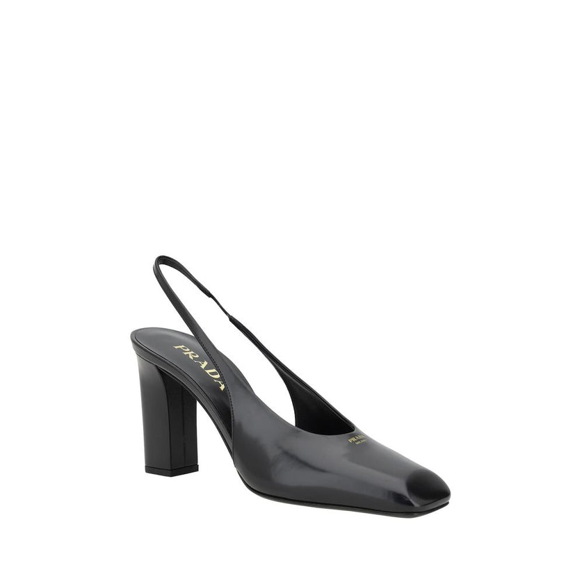 Black Calf Leather PumpsPrada’s leather Décolleté Pumps feature a square toe that gives a modern, refined look. The iconic press-stamped monogram on the front adds a distinctive brand touch. The elasticized slingback design offers a comfortable and secure