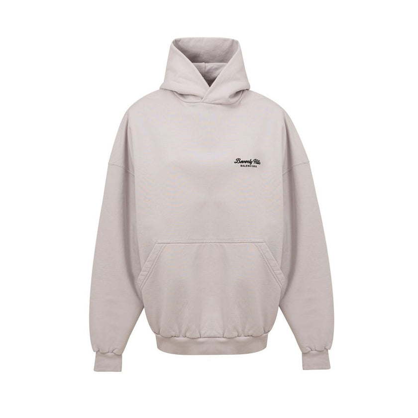 Gray Cotton SweatshirtUnisex Oversized Hoodie ‘Beverly Hills’ Balenciaga. In off white cotton, front pocket with side inserts, contrasting logo embroidery on the side, oversized fit. Composition: 100% Cotton Internal SKU: 25MAR85 Brand SKU: 739024TQVS7Gra