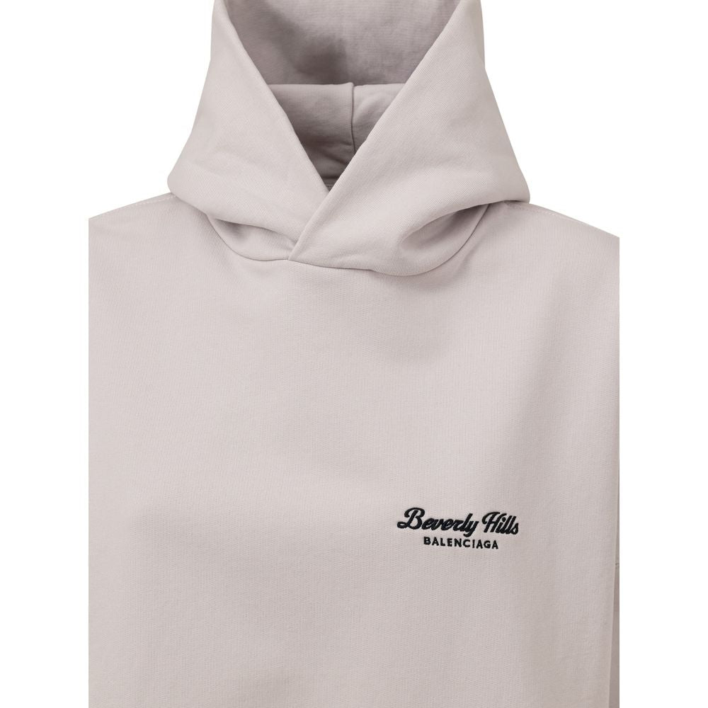 Gray Cotton SweatshirtUnisex Oversized Hoodie ‘Beverly Hills’ Balenciaga. In off white cotton, front pocket with side inserts, contrasting logo embroidery on the side, oversized fit. Composition: 100% Cotton Internal SKU: 25MAR85 Brand SKU: 739024TQVS7Gra