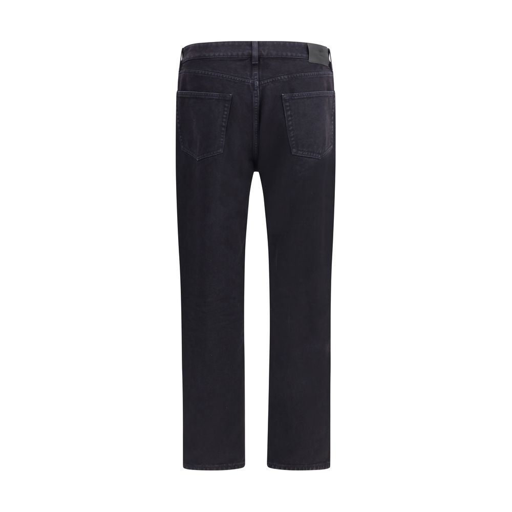 Black Cotton Straight-Leg JeansSaint Laurent’s cotton Long Mick Jeans are a stylish essential made from soft cotton. They feature a straight style that offers a straight and comfortable fit, ideal for a casual yet refined look. The front button closure ad