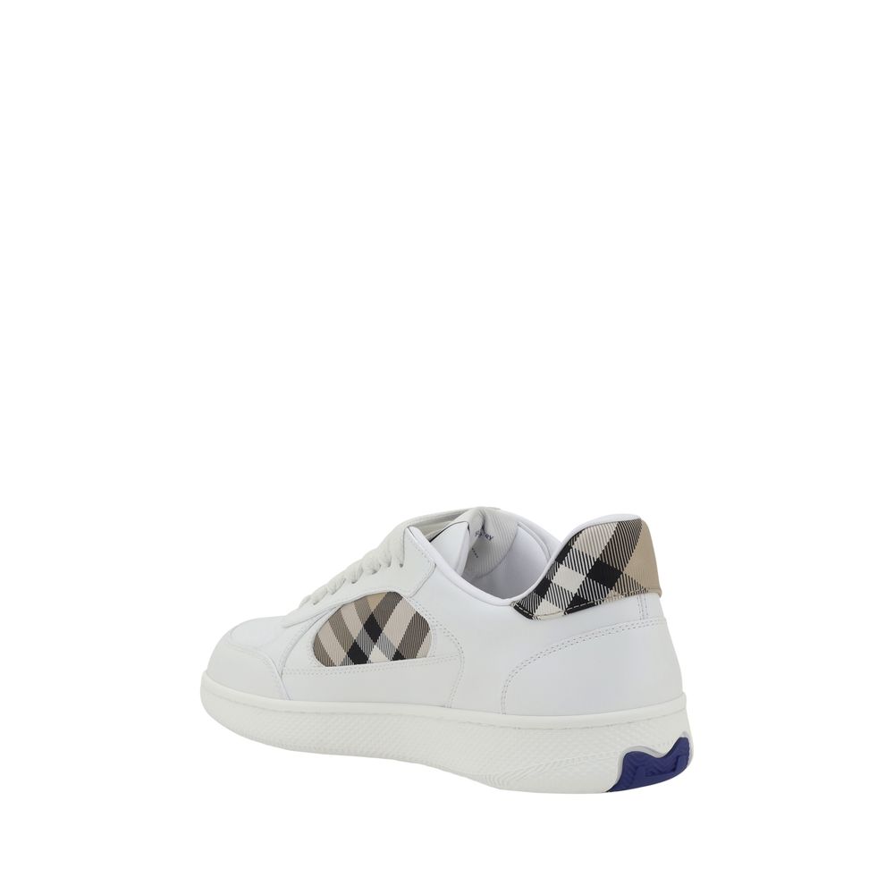 White Calf Leather Bos Taurus Low Top SneakersBurberry’s leather Sneakers combine elegance and comfort with a lace-up closure and contrasting side panel with classic Burberry Check. The model is embellished with an Equestrian Knight Design label and conto