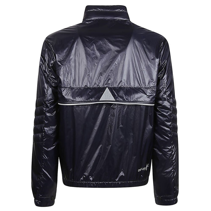 Blue Polyamide Men JacketElevate your outerwear with the Moncler Grenoble jacket, a fusion of luxe and practicality. This high-necked piece, crafted for the fashion-forward, flaunts a padded silhouette with a front zipper closure that adds an edge to any