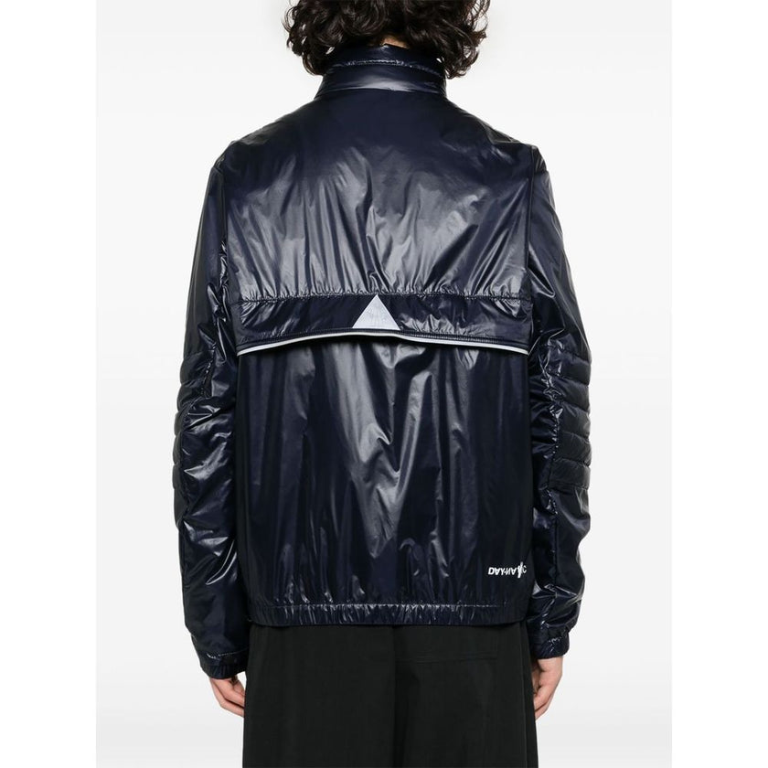 Blue Polyamide Men JacketElevate your outerwear with the Moncler Grenoble jacket, a fusion of luxe and practicality. This high-necked piece, crafted for the fashion-forward, flaunts a padded silhouette with a front zipper closure that adds an edge to any