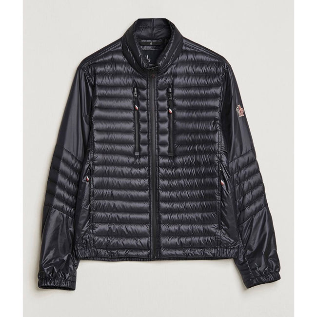 Black Polyamide Men JacketElevate your outerwear collection with the ultrachic Moncler Grenoble jacket. Engineered for both style and warmth, this sophisticated high-necked jacket features a sleek front zipper closure that seamlessly leads into its plush,