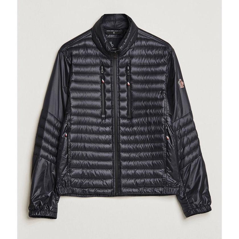 Black Polyamide Men JacketElevate your outerwear collection with the ultrachic Moncler Grenoble jacket. Engineered for both style and warmth, this sophisticated high-necked jacket features a sleek front zipper closure that seamlessly leads into its plush,