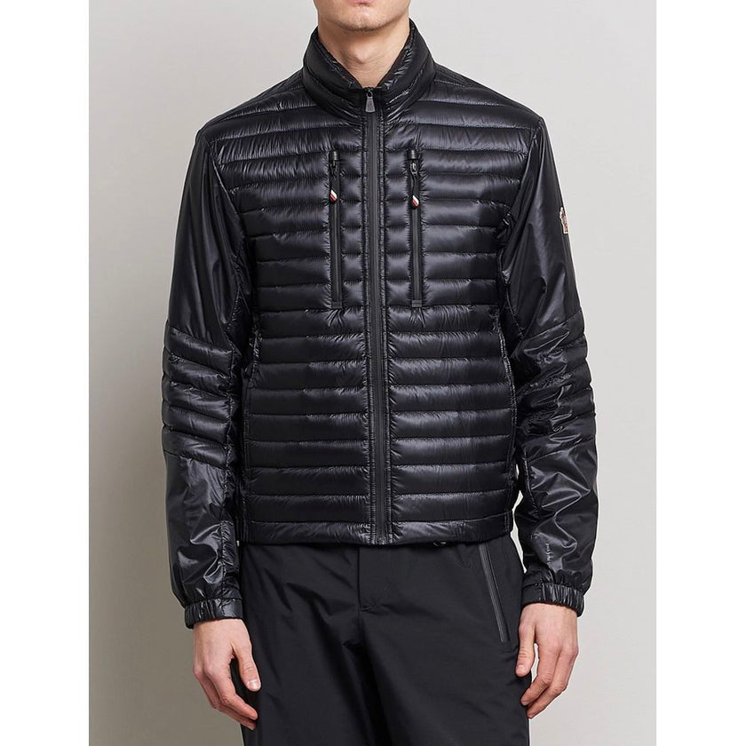 Black Polyamide Men JacketElevate your outerwear collection with the ultrachic Moncler Grenoble jacket. Engineered for both style and warmth, this sophisticated high-necked jacket features a sleek front zipper closure that seamlessly leads into its plush,