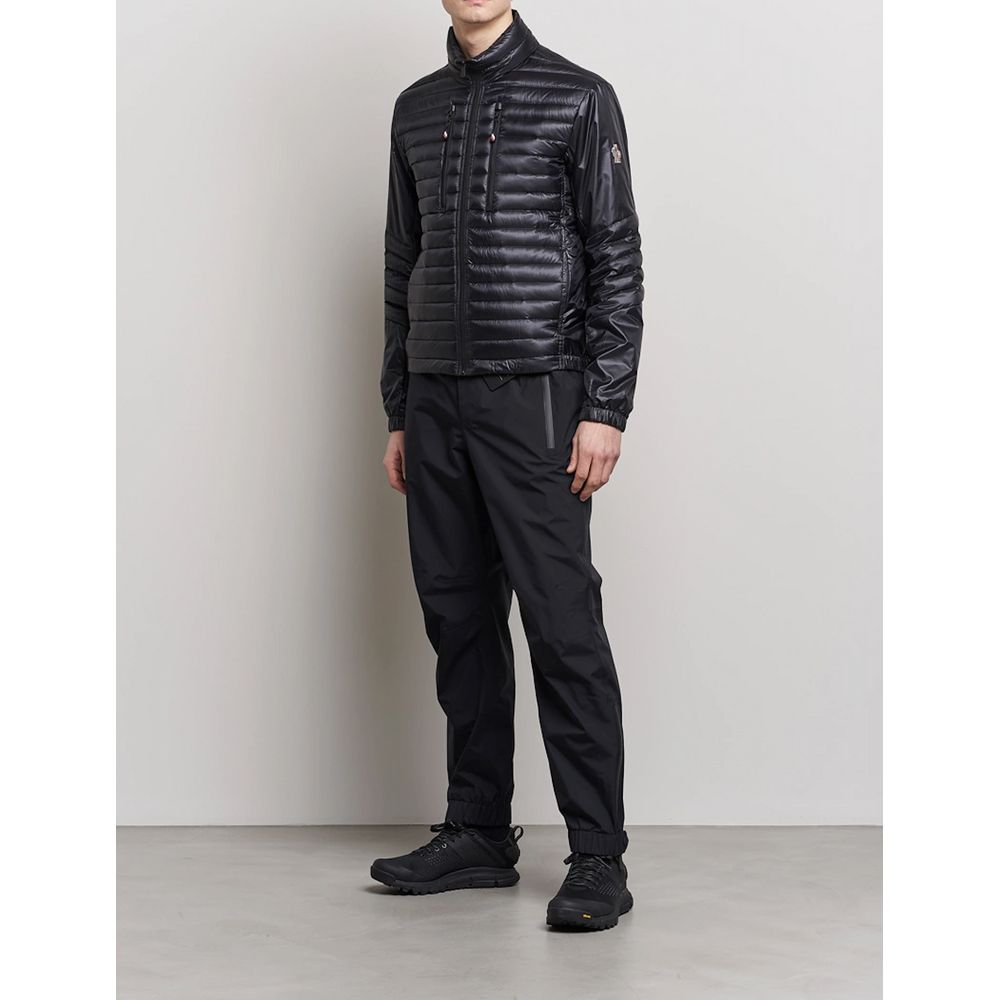 Black Polyamide Men JacketElevate your outerwear collection with the ultrachic Moncler Grenoble jacket. Engineered for both style and warmth, this sophisticated high-necked jacket features a sleek front zipper closure that seamlessly leads into its plush,