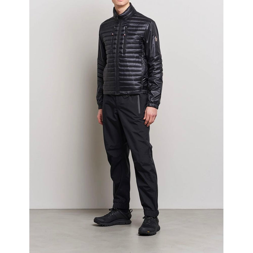 Black Polyamide Men JacketElevate your outerwear collection with the ultrachic Moncler Grenoble jacket. Engineered for both style and warmth, this sophisticated high-necked jacket features a sleek front zipper closure that seamlessly leads into its plush,