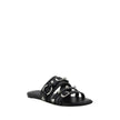 Black Calf Leather Bos Taurus Flat SandalsBalenciaga’s studded Sandals combine a bold and sophisticated design. A slip-on model with a flat sole, they feature three front straps decorated with silver studs and rings, giving them a modern, rock look. These