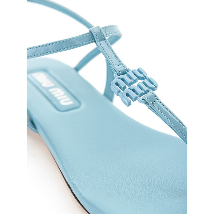 Blue Patent Leather Flip-Flop SandalsMiu Miu Azure Patent Leather Thong Sandal. Square toe, fully open front, T-Style and logo lettering on front. Thin leather outer sole and contrasting under heel in black. Composition: 100% Leather-Sku inside:24GIU41Blu