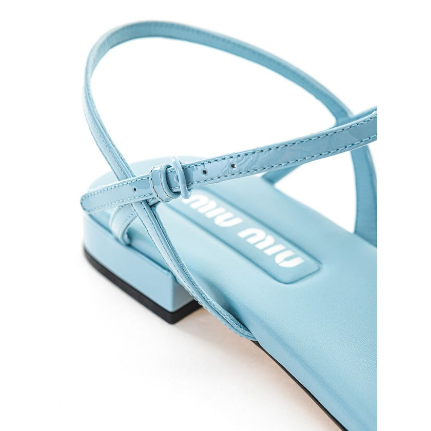 Blue Patent Leather Flip-Flop SandalsMiu Miu Azure Patent Leather Thong Sandal. Square toe, fully open front, T-Style and logo lettering on front. Thin leather outer sole and contrasting under heel in black. Composition: 100% Leather-Sku inside:24GIU41Blu
