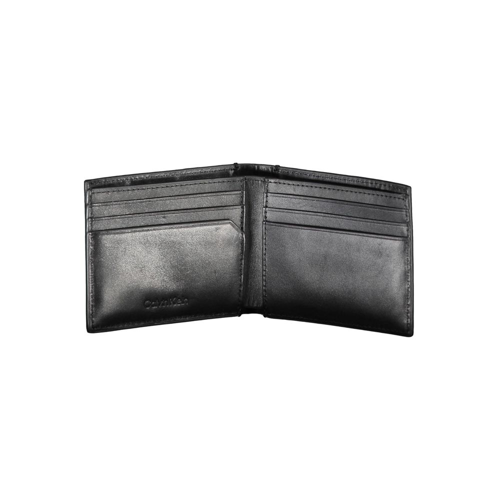 Black Eco Leather Men WalletDive into the epitome of sophistication with this Calvin Klein wallet, an accessory designed for the modern man who appreciates style with functionality. Its sleek black hue boasts a minimalist aesthetic while the RFID blocking