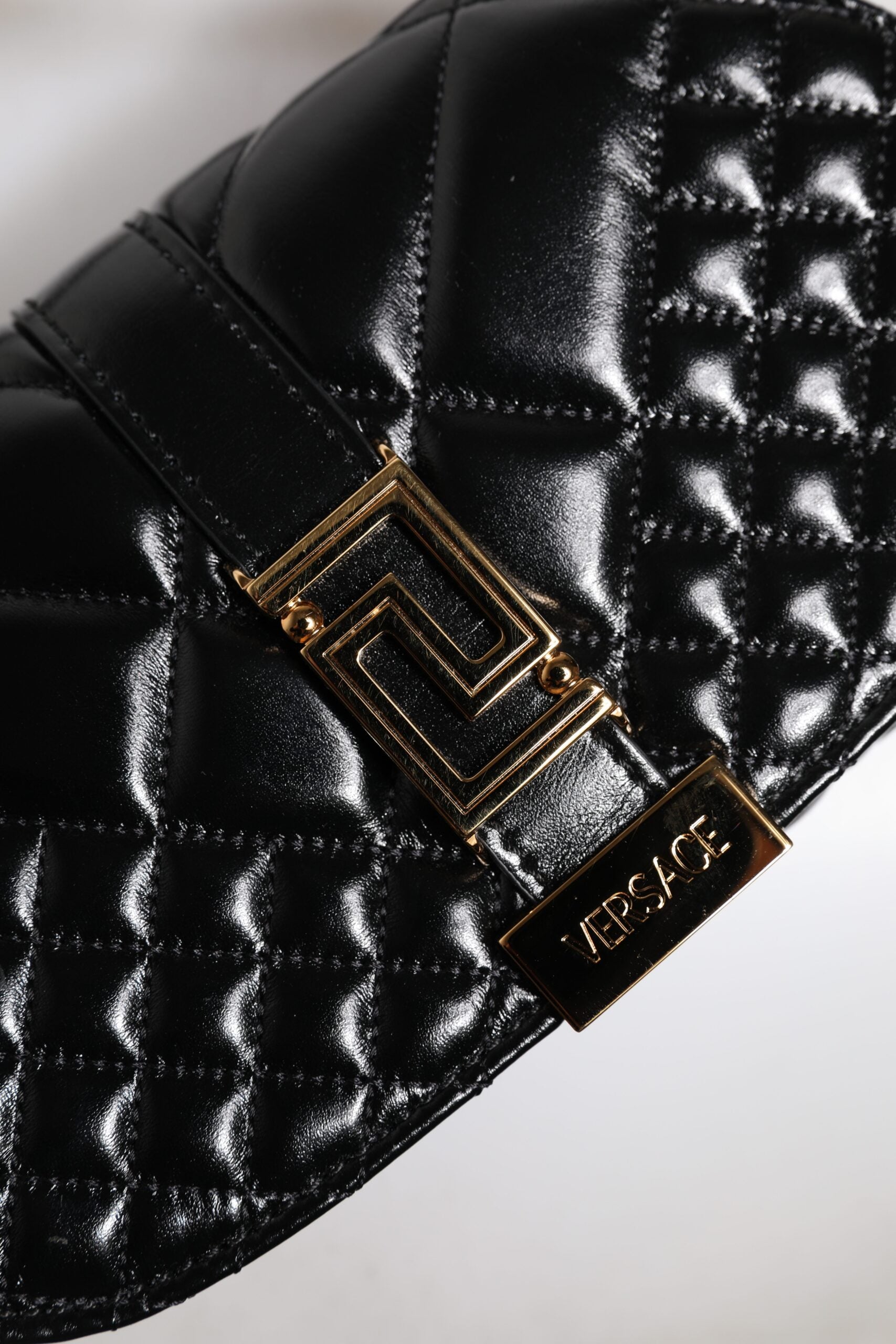Black Calf Leather Quilted Shoulder Strap BagVERSACE Absolutely stunning, 100% Authentic, brand new VERSACE solid color, shoulder strap. Model: Shoulder bag Material: Calfskin Colour: Black Black inner lining with inside pocket Handle: Adjustable shoulder