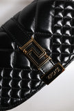 Black Calf Leather Quilted Shoulder Strap BagVERSACE Absolutely stunning, 100% Authentic, brand new VERSACE solid color, shoulder strap. Model: Shoulder bag Material: Calfskin Colour: Black Black inner lining with inside pocket Handle: Adjustable shoulder