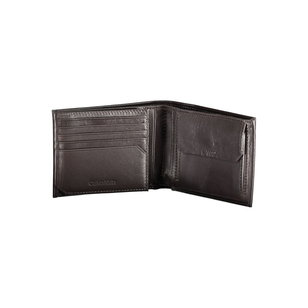 Brown Leather Men WalletIndulge in the essence of sophistication with this Calvin Klein wallet, crafted for the modern man who appreciates the finesse of luxury. With two spacious compartments and a dedicated coin purse, it meets practicality with style.