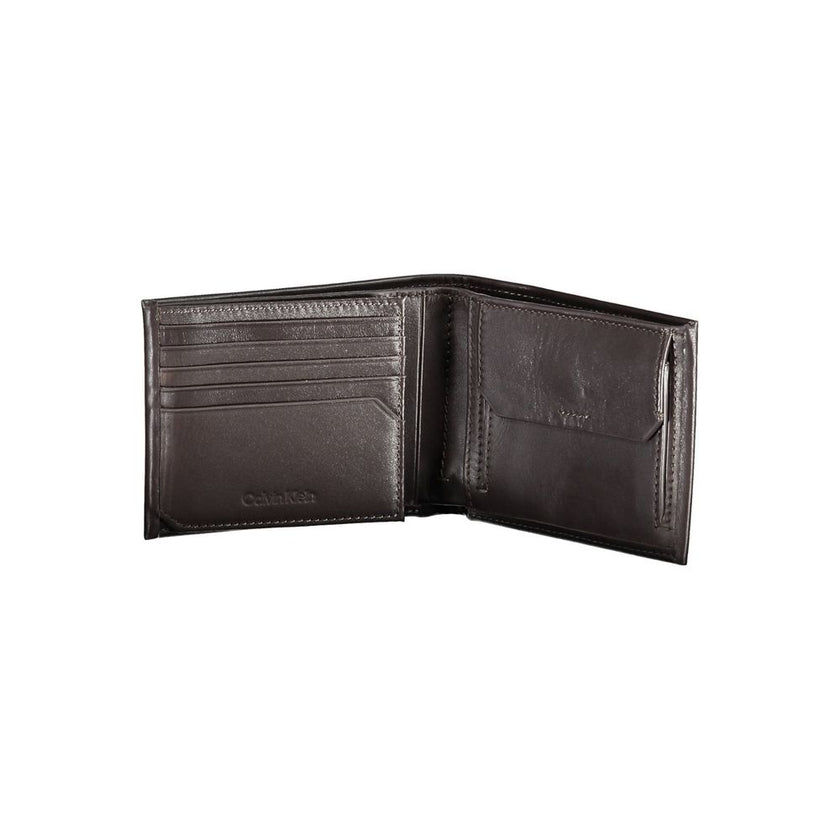 Brown Leather Men WalletIndulge in the essence of sophistication with this Calvin Klein wallet, crafted for the modern man who appreciates the finesse of luxury. With two spacious compartments and a dedicated coin purse, it meets practicality with style.