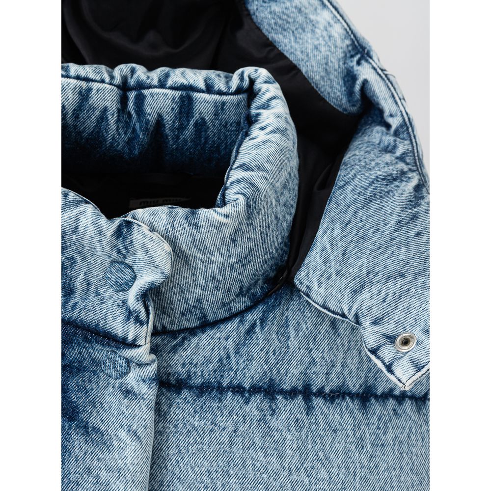 Blue Polyester CoatPuffy down jacket in Miu Miu denim. Covered front zipper and button closure, two zippered side pockets, removable hood.Applied logo on back. Puffy pattern, fully padded, elastic cuffs and adjustable drawstring waist. Inner SKU: 24 LU 10