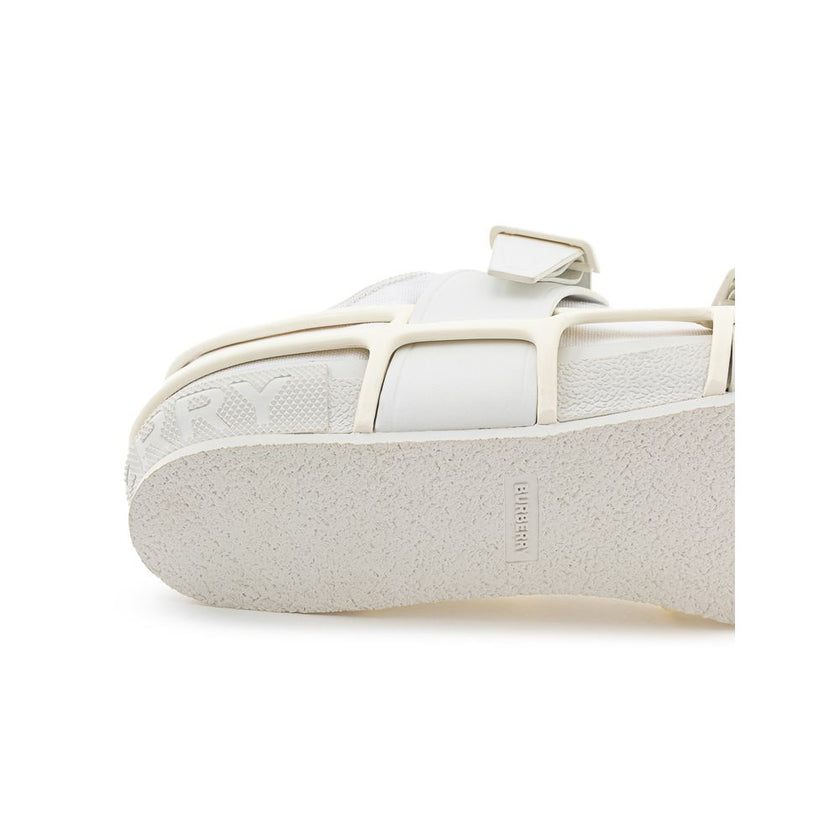 White Cotton Athletic SneakersBurberry White Canvas Sneaker with External Rubber Structure. Front fastening with tone-on-tone laces, round toe with white shiny rubber detail, engraved logo on the back. The shoe is covered with a white rubber/plastic struc