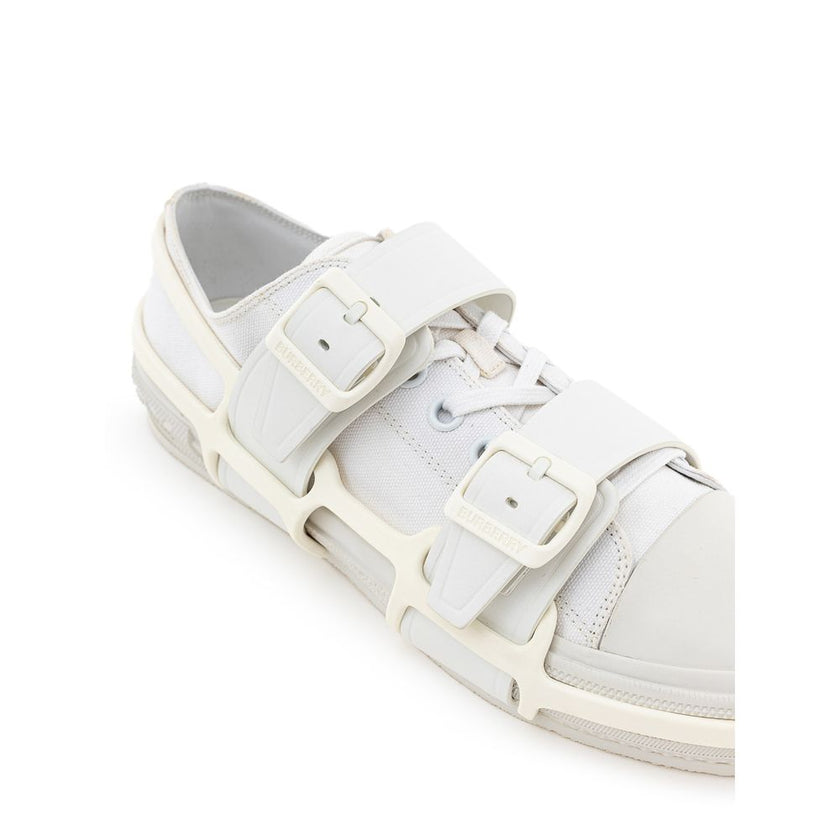 White Cotton Athletic SneakersBurberry White Canvas Sneaker with External Rubber Structure. Front fastening with tone-on-tone laces, round toe with white shiny rubber detail, engraved logo on the back. The shoe is covered with a white rubber/plastic struc