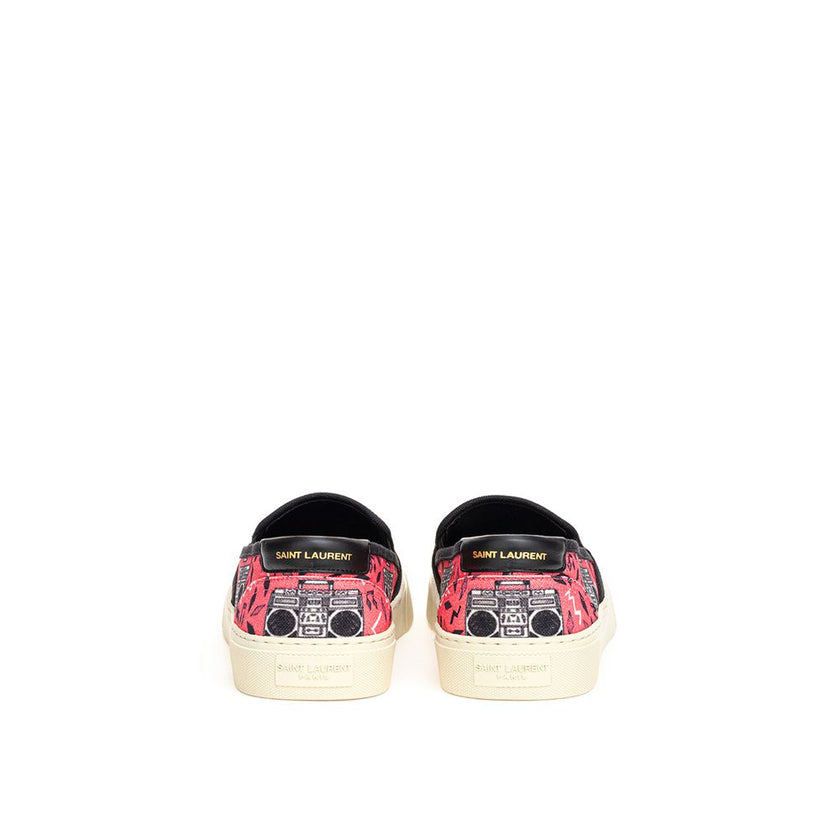 Pink Cotton Platform SneakersPink Canvas Slip-On with Radio Print Saint Laurent. Venice slip-on in pink cotton canvas with allover print, white rubber sole, round toe, black leather back tab with logo. Printed logo on the back of the sole. Sole height: 3