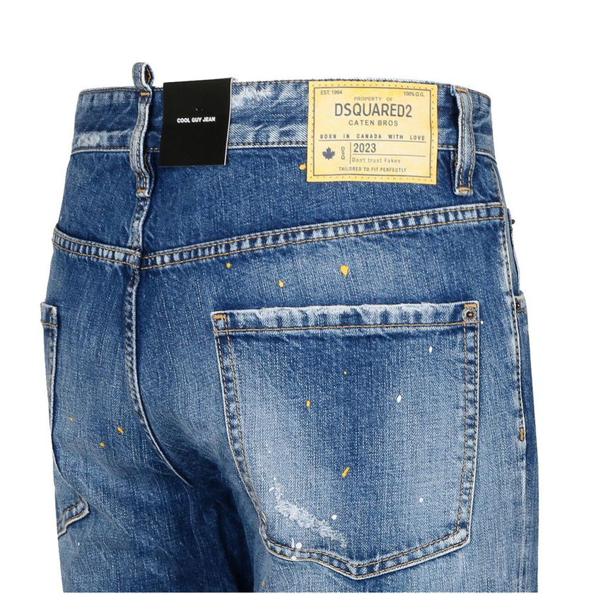 Blue Cotton Men's Slim-Fit JeanElevate your denim game with Dsquared²’s expertly crafted slim fit jeans. These striking blue cotton jeans boast a unique edge with bold dark denim patches, artful tears, and dynamic paint splash details. Designed for those