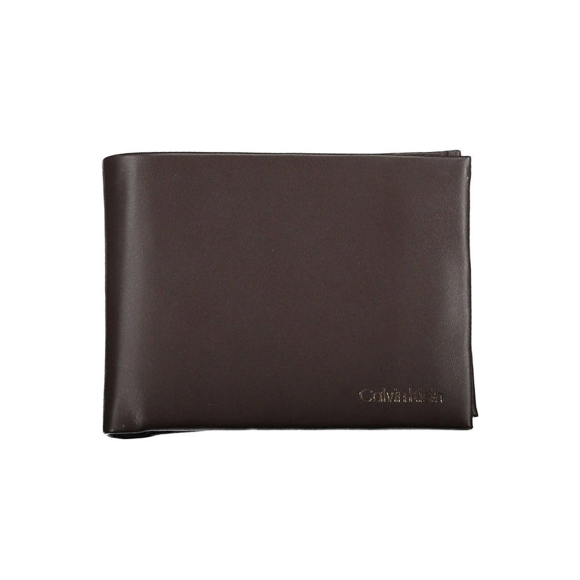 Elegant Leather Dual-Compartment WalletRefinement and functionality fuse in this exquisite Calvin Klein wallet, crafted from premium leather. Equipped with two compartments, this wallet offers ample space for currency and essential cards. A coin purse add