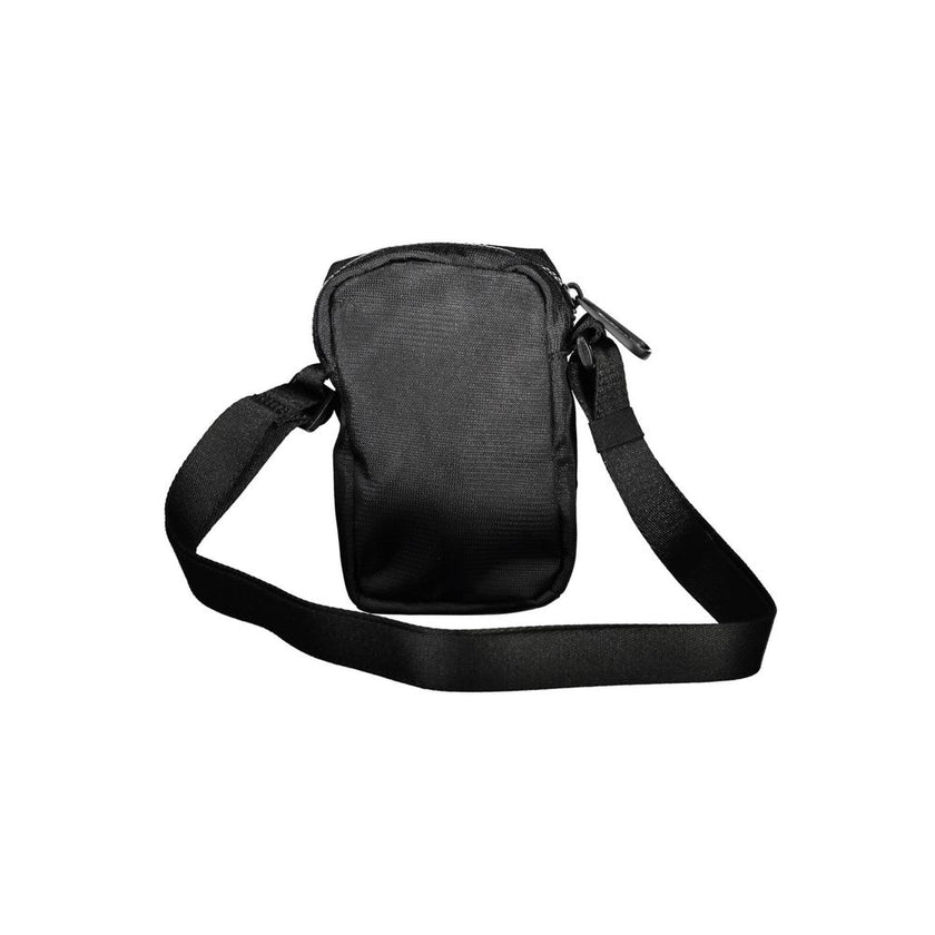 Elegant Black Shoulder Bag with Chic DetailingDiscover the epitome of accessory sophistication with this sleek Black Shoulder Bag, ideal for the modern man who appreciates luxury with practicality. A product from the iconic fashion house Calvin Klein, thi