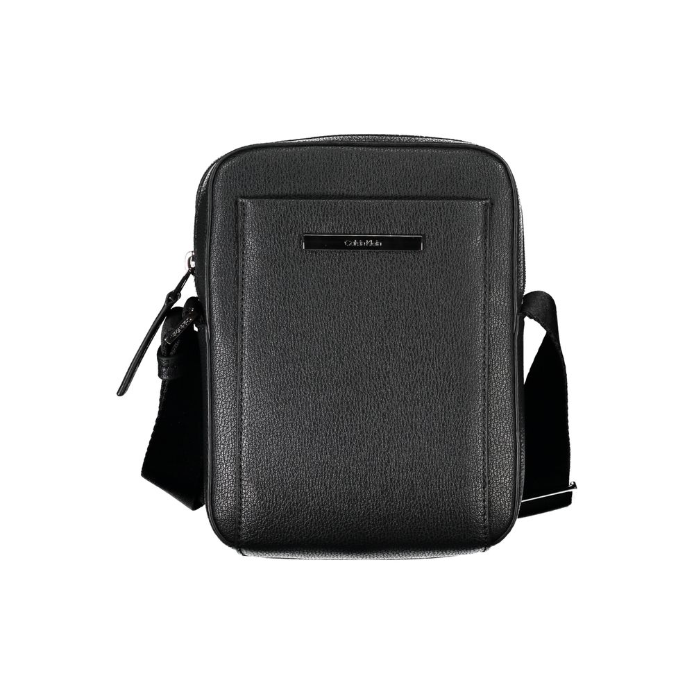 Sleek Black Shoulder Bag with Logo DetailExperience the perfect blend of functionality and style with this sleek black shoulder bag from the renowned Calvin Klein. Designed for the modern individual, it boasts an adjustable shoulder strap for customized c