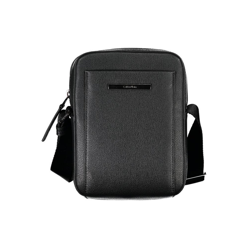 Sleek Black Shoulder Bag with Logo DetailExperience the perfect blend of functionality and style with this sleek black shoulder bag from the renowned Calvin Klein. Designed for the modern individual, it boasts an adjustable shoulder strap for customized c