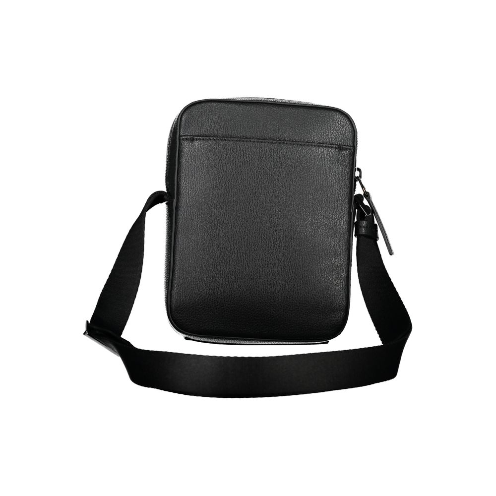 Sleek Black Shoulder Bag with Logo DetailExperience the perfect blend of functionality and style with this sleek black shoulder bag from the renowned Calvin Klein. Designed for the modern individual, it boasts an adjustable shoulder strap for customized c